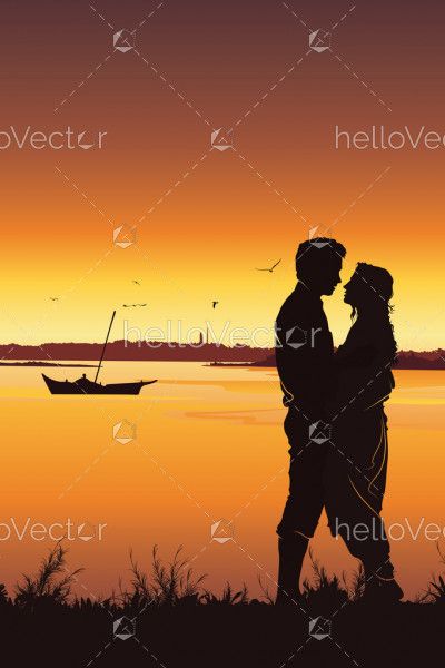 Silhouette of young romantic couple on sunset background