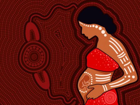 Pregnant woman painting in aboriginal dot style